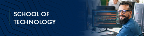 Banner for School of Technology with a smiling man working on computers displaying code.